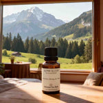 Close-up of the Alpine Bloom aromatherapy essential oil blend bottle, scented like morning air.