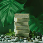 Close-up of the Fresh Clarity natural soap bar texture with visible green tea leaves and spearmint.